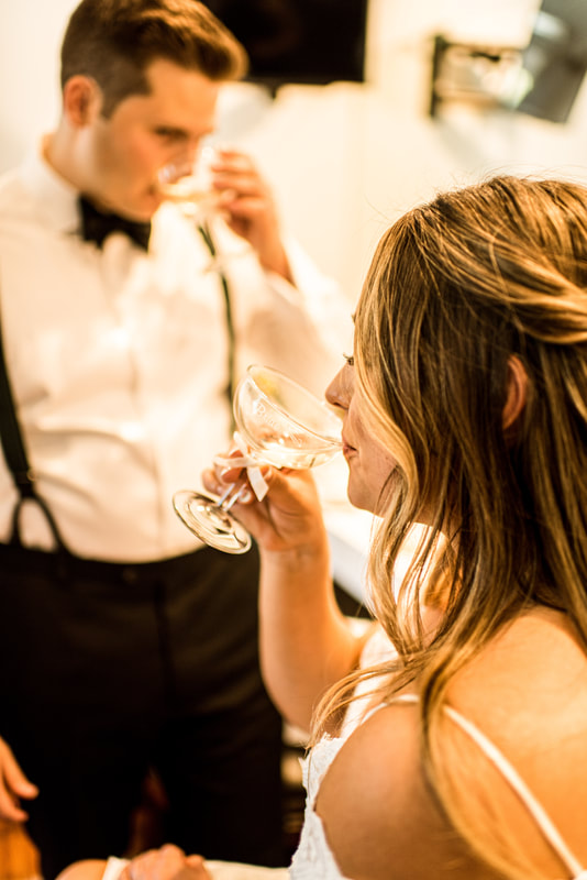 bride and groom drink champagne 